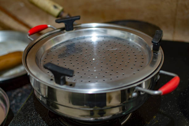 istock Vegetable steamer on gas stove for heating 1050280212