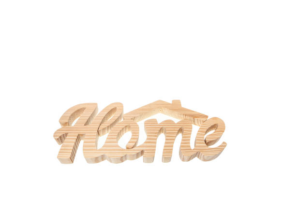 Home sweet home, wood text isolated on white background with copy space stock photo