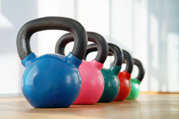 Colorful kettlebells in gym