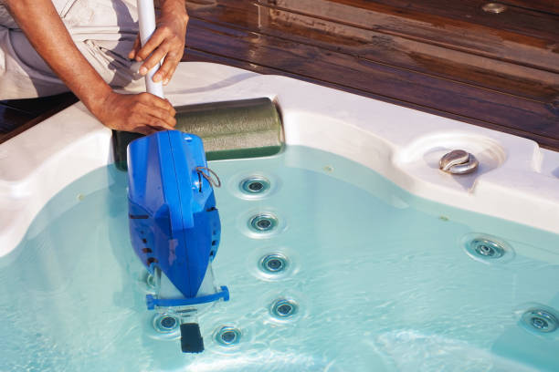 istock Hotel staff worker cleaning the pool 1050284616