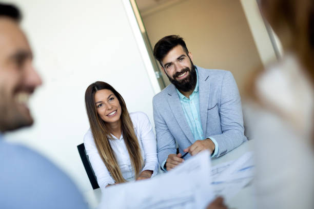 istock Business people having fun and chatting at workplace office 1050287182