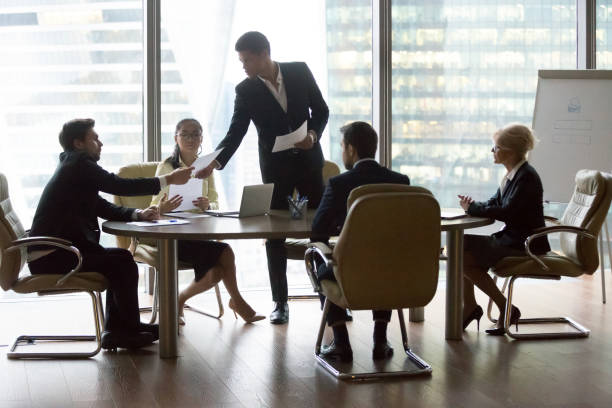 istock Businesspeople colleagues and black team leader 1050287408