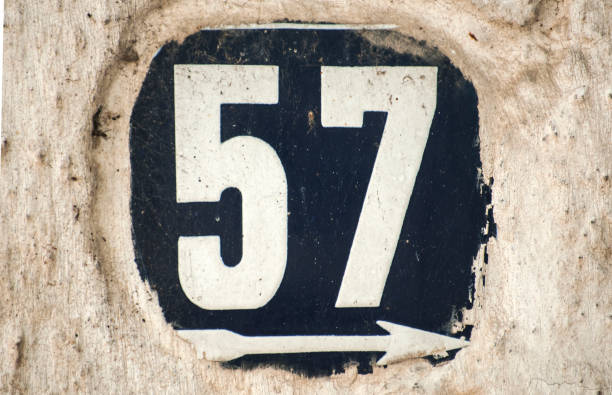 istock Weathered enameled plate number 57 1050290488