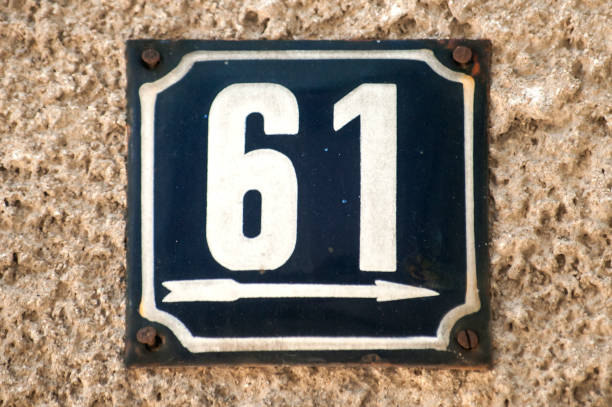 istock Weathered enameled plate number 61 1050290490