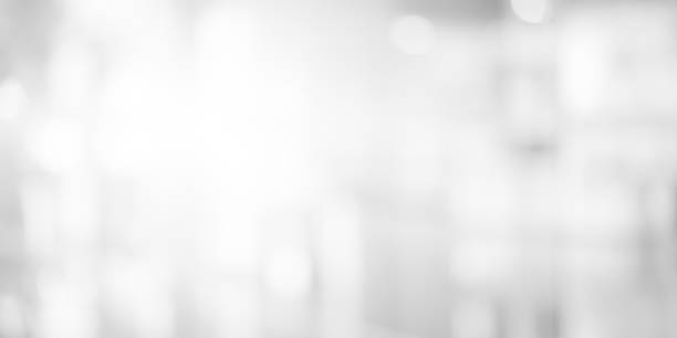 istock abstract blurry soft focus shine brighten white silver wallpaper with bokeh circle light for merry christmas and happy new year festival season as panoramic background concept 1050294762