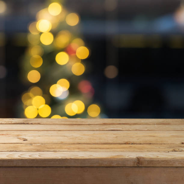 istock Empty wooden table over  bokeh lights background 1050297496