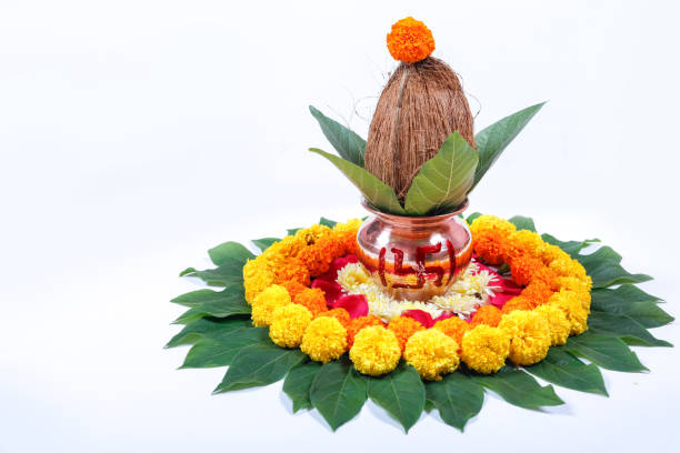 istock Copper Kalash with coconut , leaf and floral decoration on a white background. essential in hindu puja. 1050303816