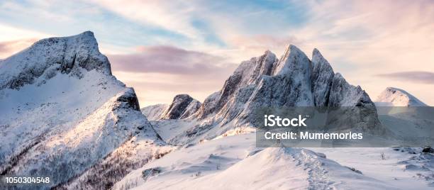 Panorama Of Mountaineer Standing On Top Of Snowy Mountain Range Stock Photo - Download Image Now