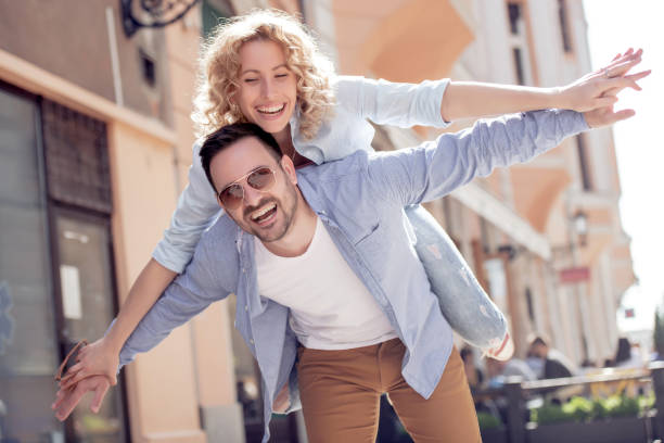 istock Happy young couple having fun outdoors 1050307184