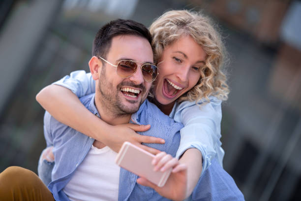 istock Summer holidays, technology,love,relationship and dating concept 1050307772