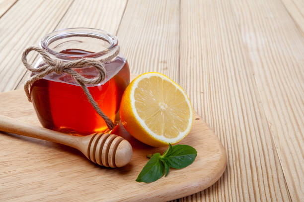 istock honey, lemon and ginger on a wooden background 1050308684