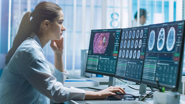 istock Female Medical Research Scientist Working with Brain Scans on Her Personal Computer. Modern Laboratory Working on Neurophysiology, Science, Neuropharmacology. Understanding Human Brain. 1050311488