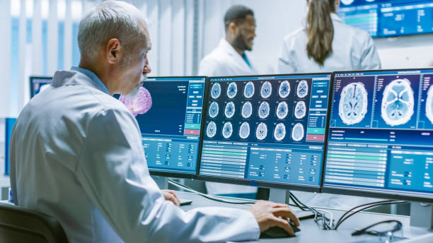 istock Senior Medical Research Scientist Working with Brain Scans on His Personal Computer. Modern Laboratory Working on Neurophysiology, Science, Neuropharmacology. Understanding Human Brain. 1050311508