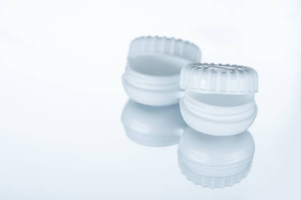 istock close up view of empty container for contact lenses on white backdrop with reflection 1050319092