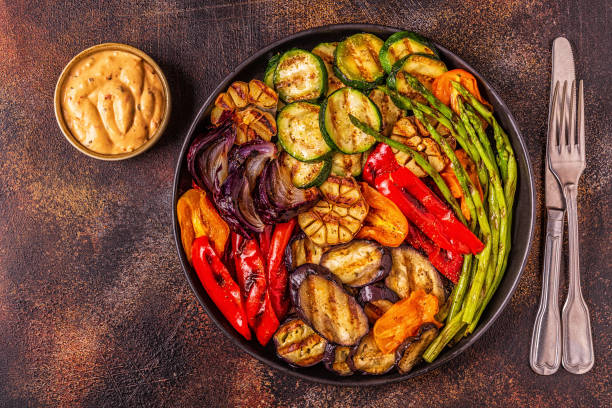 istock Grilled vegetables on a plate with sauce 1050329322