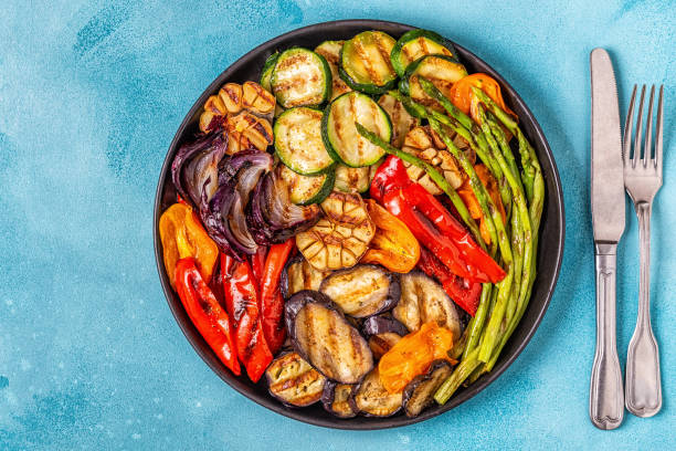 istock Grilled vegetables on a plate with sauce 1050329384