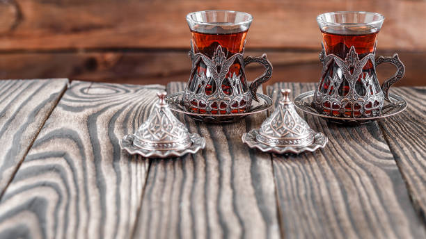 istock Fragrant Turkish tea and Turkish sweets in national dishes 1050332814