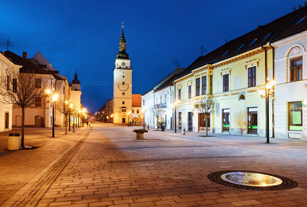 trnava old town (hlavna street and city tower) at night, slovakia - trnava imagens e fotografias de stock