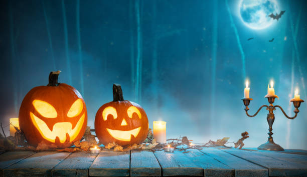 istock Spooky halloween pumpkins in forest 1050343446
