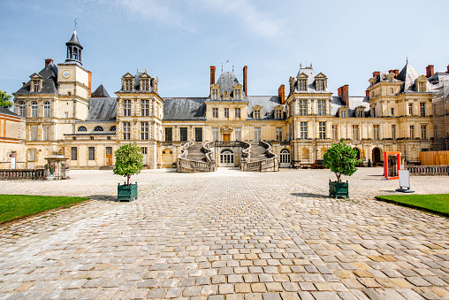 FONTAINBLEAU, FRANCE - August 28, 2017: View on the palace of Fontainebleau with White Horse court located on the southeast of Paris in France