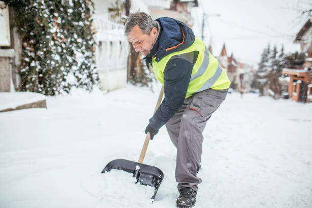 istock Man cleaning snow on the street 1050349916