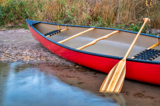 istock red canoe on a lake shore 1050353150