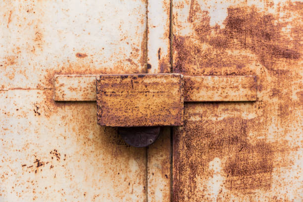 istock metal door closed on the padlock 1050354758