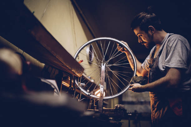 istock Man repairing bicycle wheel 1050359442
