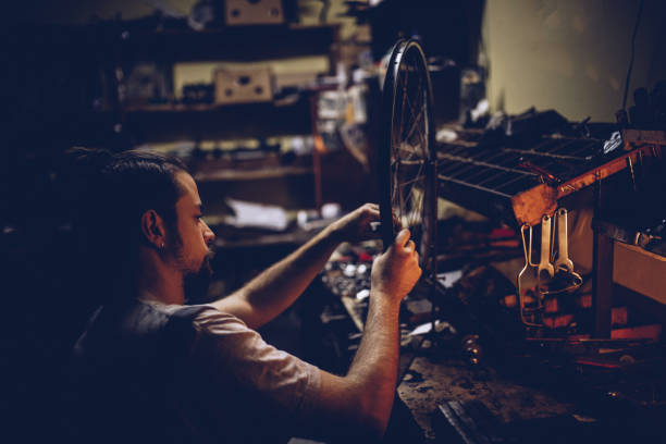 istock Man works alone in repair shop 1050362070