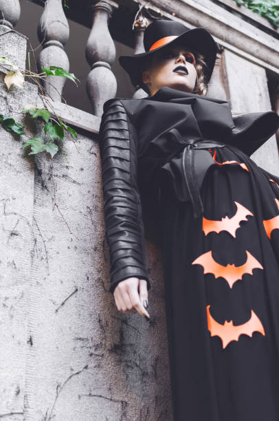 istock Girl wearing a halloween costume posing 1050368730