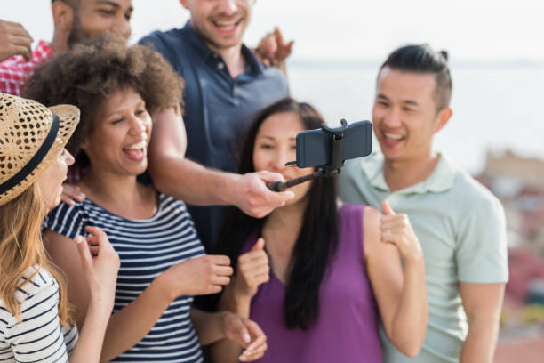 istock Group Of Friends Making Photos 1050374692