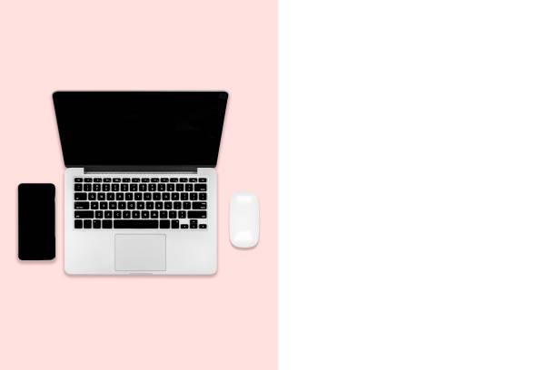 istock Flat lay photo of office table with laptop computer, digital tablet, mobile phone and accessories. on modern two tone background. Desktop office mockup concept. 1050383616
