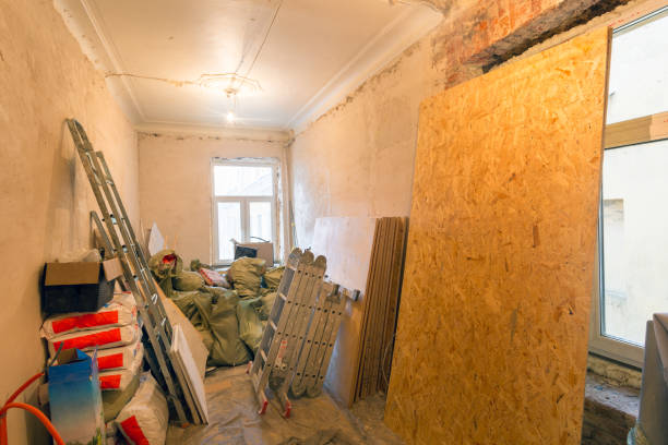 istock Ladders, bags with putty, construction tools and materials, sheets of drywall are in an  apartment is under construction, remodeling, renovation, extension, overhaul, restoration, home improvement and reconstruction 1050393508