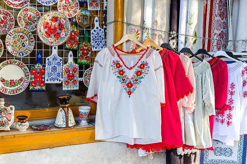 Ethnic Shirts With Hungarian Embroidery And Decorative Painted Plates And Cutting Boards In A Street Store Stock - Download Image - iStock