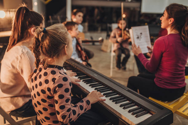 istock Busy day in kids music school 1050399408