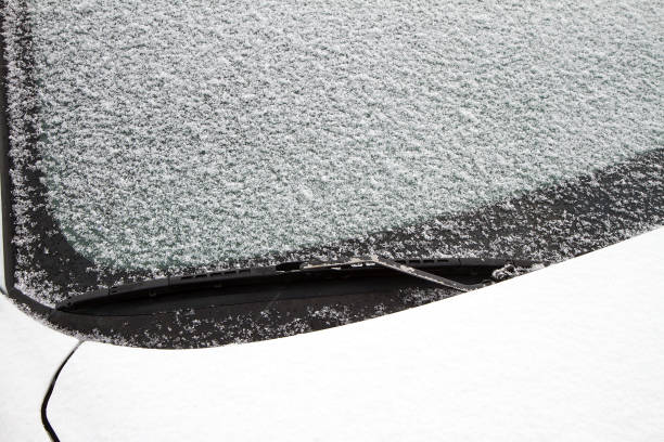 istock snow covering the windshield of a car 1050407536
