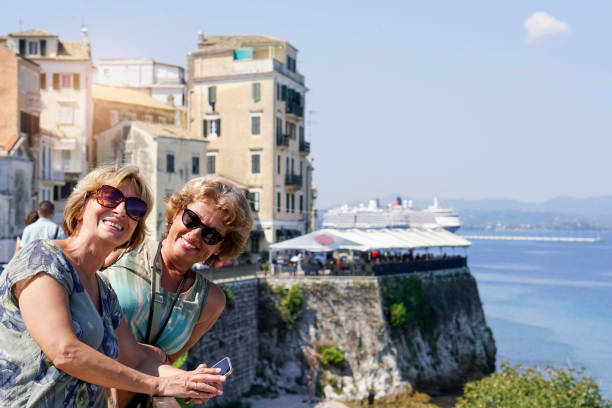 istock Two Senior women exploring the Corfu town 1050411266