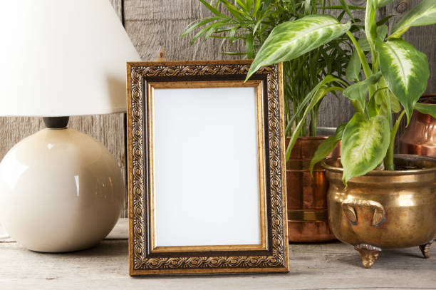 istock Empty brass picture frame on wooden background. 1050416808