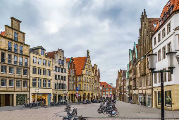 Prinzipalmarkt is historic street with buildings with picturesque pediments attached to one another in Munster, Germany
