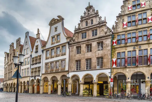 Prinzipalmarkt is historic street with buildings with picturesque pediments attached to one another in Munster, Germany