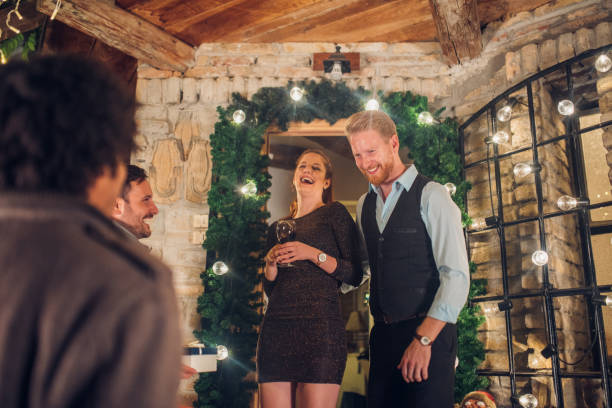 istock Smiling couple looking at their friends 1050423256