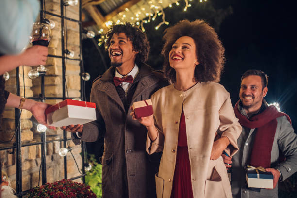istock People holding presents and smiling 1050423260