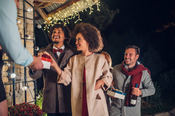 istock Young people holding gifts 1050423624