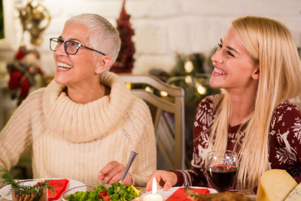 istock Happy women at Christmas dinner 1050426492