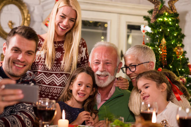 istock Family taking selfie over Christmas dinner 1050429244
