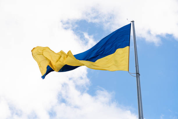 istock Ukrainian flag in the sky close up 1050431828