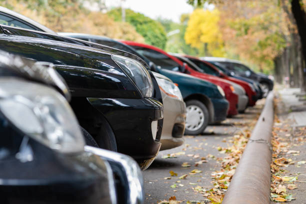 istock Cars in a row on parking close up 1050431830