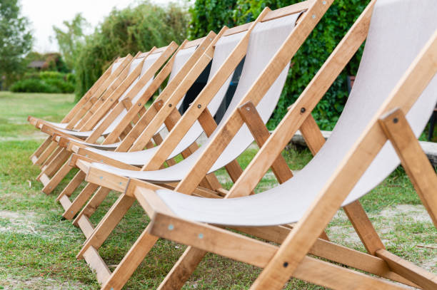 istock Three lounge white wooden chairs close up 1050434604