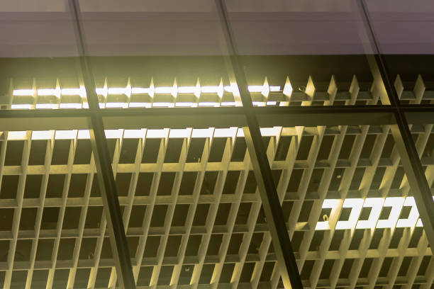 istock Close Up Shot Inside A Glass Modern Office At Night From An Interesting Angle Below 1050440272