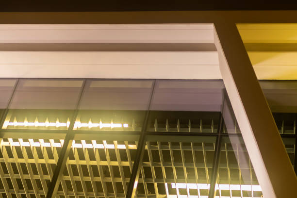 istock Abstract Shot Inside A Glass Modern Office At Night From Below 1050440290